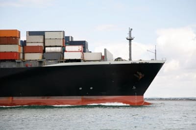 Cargo ship transporting steel and raw materials